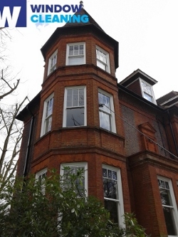 third floor windows cleaned with water fed pole